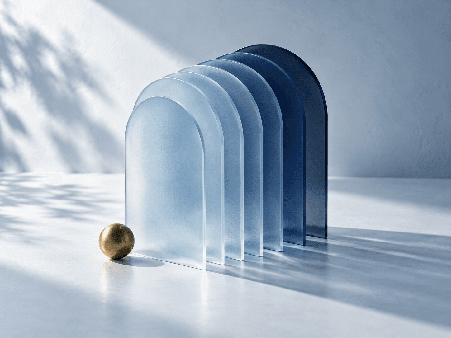 Seven translucent blue arches layered like the pages of a book, with a small brass sphere
